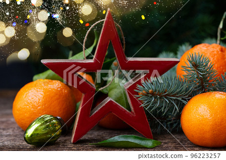 Christmas scene with tangerines Christmas scene with tangerines 96223257