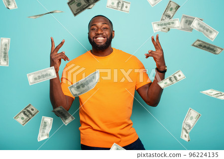 Boy wins money. Amazed and surprised expression face. Light blue background. 96224135