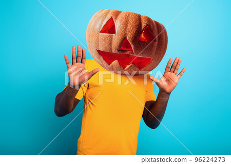 Man with pumpkin instead of head. concept of halloween festivity 96224273
