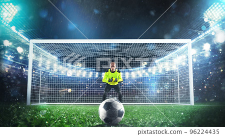 Soccer goalie ready to save a penalty kick at the stadium 96224435