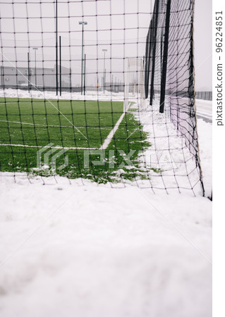 Football field is cleared of snow in winter time Football field is cleared of snow in winter time 96224851