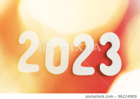 wooden number 2023 on christmas shiny gold and red background. sparkle festive blurred bokeh wooden number 2023 on christmas shiny gold and red background. sparkle festive blurred bokeh 96224909