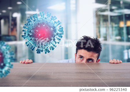 Man is afraid of the covid19 virus and he is hidden rear a desk 96225340