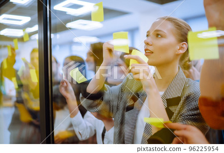 Young business team people brainstorm on corporate project together write strategy tasks Young business team people brainstorm on corporate project together write strategy tasks 96225954