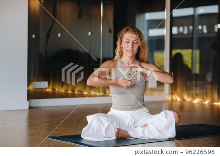 The girl does yoga and is in a state of meditation. The concept of a healthy lifestyle 96226598