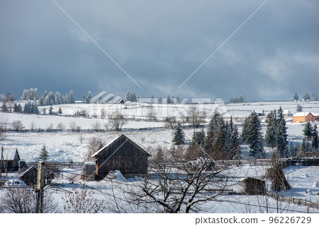 Alpine village in winter in Transylvania 96226729