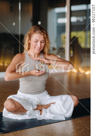 The girl does yoga and is in a state of meditation. The concept of a healthy lifestyle The girl does yoga and is in a state of meditation. The concept of a healthy lifestyle 96227107