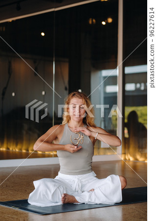 The girl does yoga and is in a state of meditation. The concept of a healthy lifestyle 96227614