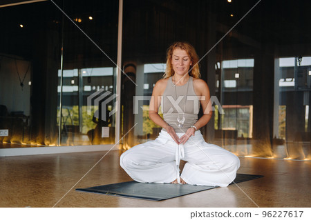 The girl does yoga and is in a state of meditation. The concept of a healthy lifestyle 96227617