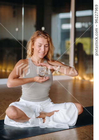 The girl does yoga and is in a state of meditation. The concept of a healthy lifestyle The girl does yoga and is in a state of meditation. The concept of a healthy lifestyle 96227969