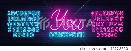 You Deserve It neon quote on a brick wall. You Deserve It neon quote on a brick wall. 96228820