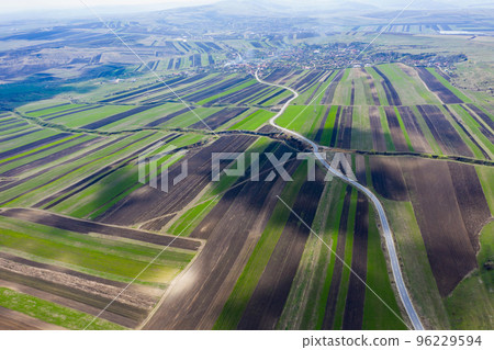 Aerial drone view of agricultural fields of plowed crops Aerial drone view of agricultural fields of plowed crops 96229594