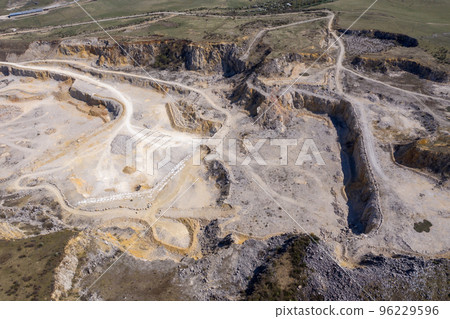 Aerial drone view of a limestone quarry, open pit mine 96229596