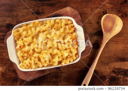 Macaroni and cheese pasta in a casserole, American gratin dish, overhead Macaroni and cheese pasta in a casserole, American gratin dish, overhead 96229734