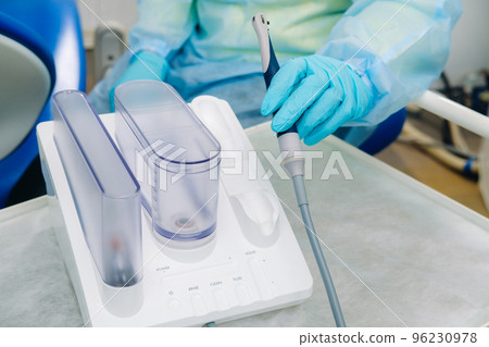 Ultrasonic scaler in the dental office. Dentistry Concept Ultrasonic scaler in the dental office. Dentistry Concept 96230978