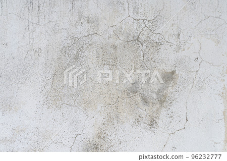 Old concrete stone wall covered with cracked plaster and dirty grunge textured surface. Old concrete stone wall covered with cracked plaster and dirty grunge textured surface. 96232777