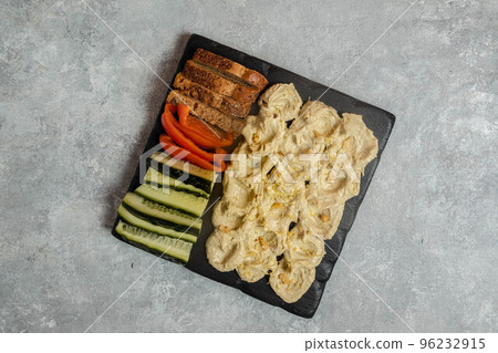 Butter border on a gray background - hummus, slices of bread, bell 96232915