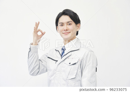 Worker giving OK sign white background 96233075