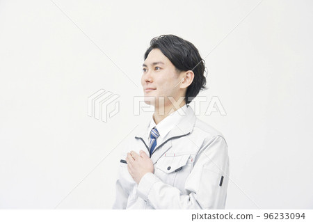 Portrait of a worker putting his hand on his chest White background 96233094