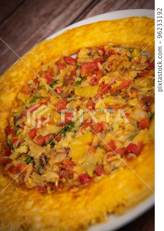 Recipe Omelette with peppers, onions, tomatoes, courgettes and coriander 96233192