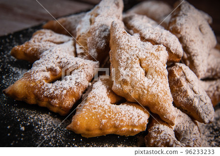 TRADITIONAL WONDERS OF SOUTH-WESTERN FRANCE, SPRINKLED WITH ICING SUGAR AND FLAVOURED WITH RUM AND TRADITIONAL WONDERS OF SOUTH-WESTERN FRANCE, SPRINKLED WITH ICING SUGAR AND FLAVOURED WITH RUM AND 96233233