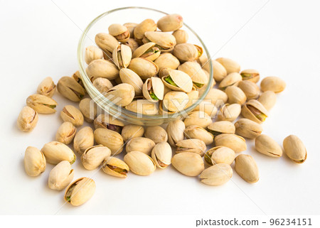 roasted pistachios on white background 96234151