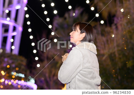 A woman enjoying winter illuminations A woman enjoying winter illuminations 96234830