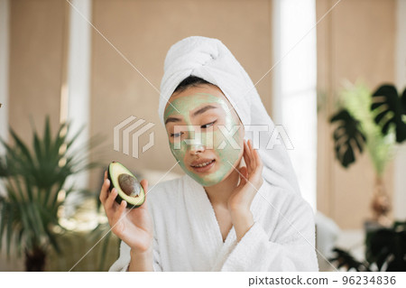 Pretty lady doing skin care procedures indoors at home. 96234836