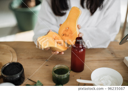 Cropped view of beautiful healthy asian woman preparing natural cosmetics 96235087