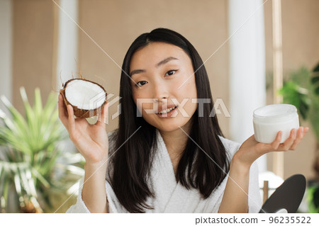 Blogger or content creator asian woman preparing natural cosmetics at home Blogger or content creator asian woman preparing natural cosmetics at home 96235522