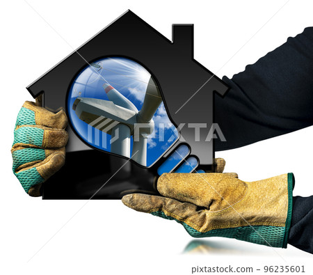 Gloved Hands Holding a Model House with Wind Turbine and Light Bulb 96235601