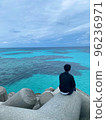 Back view of a young man at dusk in a tetrapod 96236971