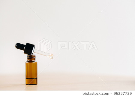 Essential oil in one bottle standing on the surface Essential oil in one bottle standing on the surface 96237729