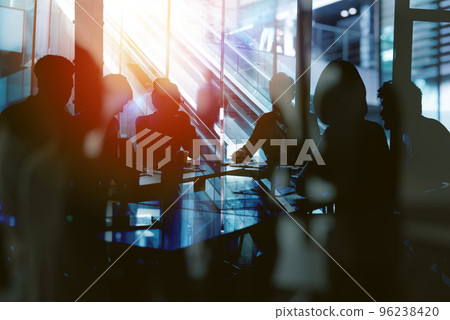 Background concept with business people silhouette at work. Double exposure and light effects Background concept with business people silhouette at work. Double exposure and light effects 96238420