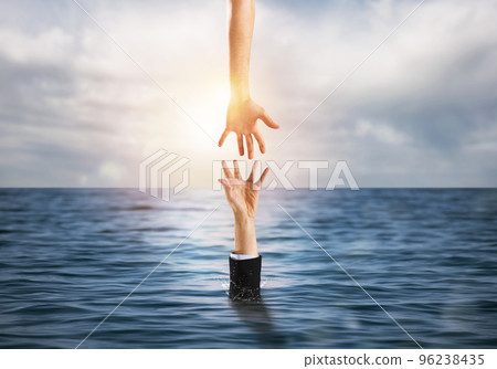 Businessman is drowning in the ocean and receives help 96238435