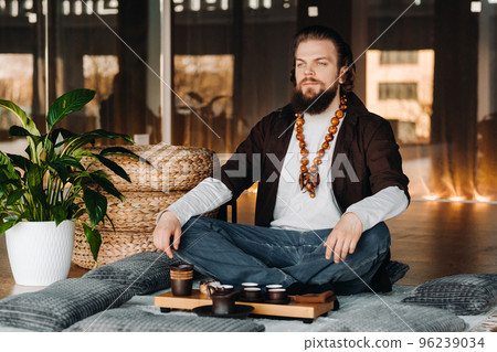 The tea master is preparing to hold a tea ceremony in the interior The tea master is preparing to hold a tea ceremony in the interior 96239034