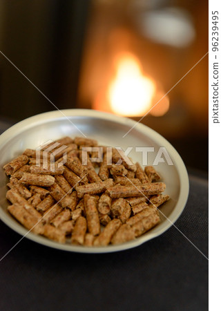 Wood pellets and pellet stove flame Wood pellets and pellet stove flame 96239495