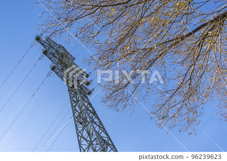High transmission tower against a clear sky High transmission tower against a clear sky 96239623