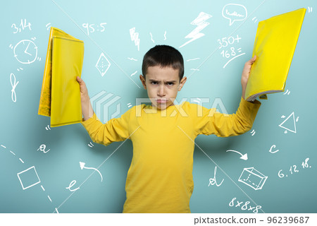 Child is unhappy and angry about too many schoolwork. cyan background 96239687