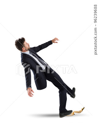 Businessman slips on a banana peel. concept of unlucky and failure 96239688