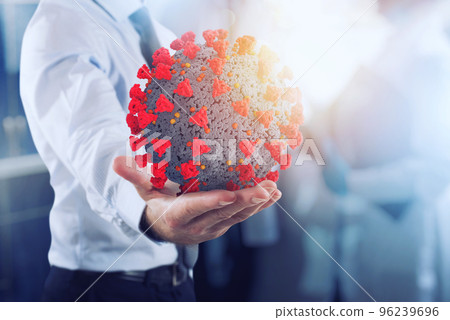 Businessman holds a bic bacteria of covid 19 ready to be examined in hospital 96239696