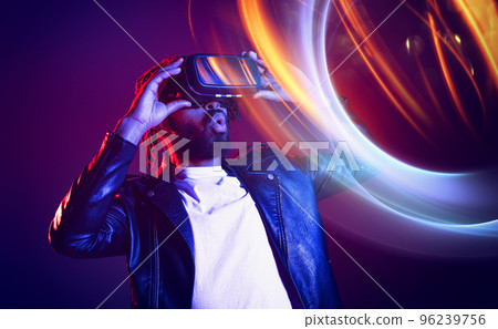 Man with VR glasses play with a virtual videogame Man with VR glasses play with a virtual videogame 96239756