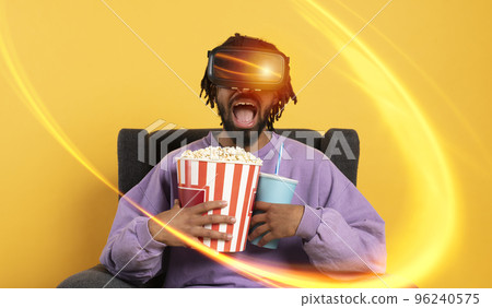 Man with VR glasses play with a virtual videogame 96240575