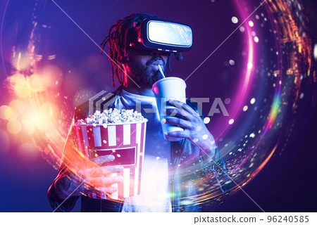 Man with VR glasses play with a virtual videogame 96240585