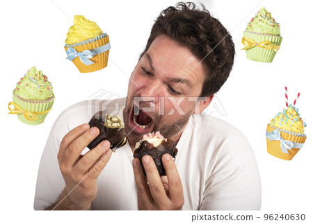 Man is very hungry and eats a lot of cupcake 96240630