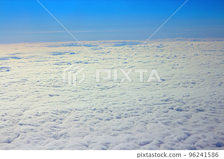 Clouds pass under wing of plane Clouds pass under wing of plane 96241586