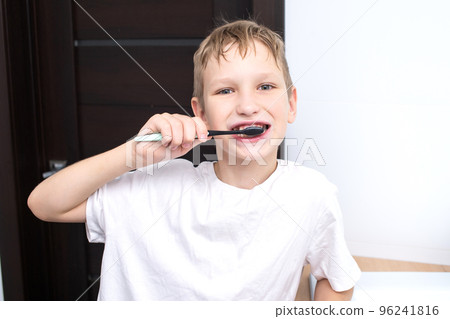 Cute boy brushing his teeth Cute boy brushing his teeth 96241816