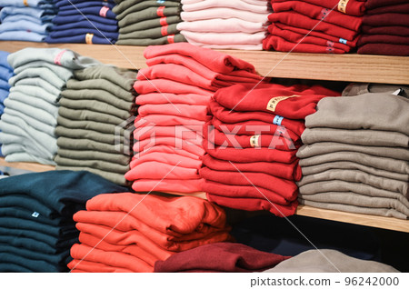 A set of colored sweaters in the store on sale A set of colored sweaters in the store on sale 96242000
