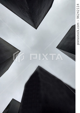 Black and white photo. Concrete structures against the sky, background. Black and white photo. Concrete structures against the sky, background. 96242114