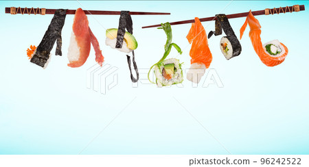 Pieces of delicious japanese sushi frozen in the air. Isolated on pastel blue background 96242522